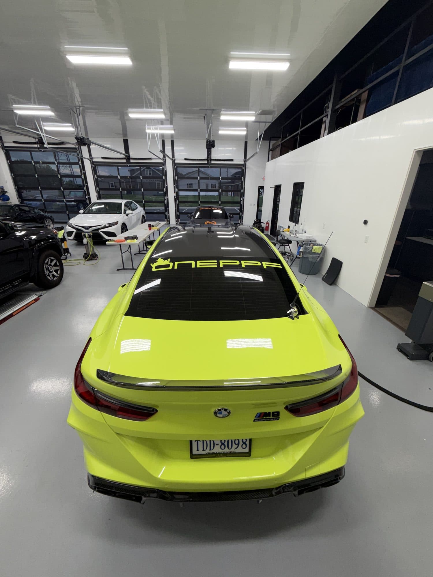 Fluorescent Yellow Color PPF BMW M8 Competition rear view with ONE PPF rear-glass decal